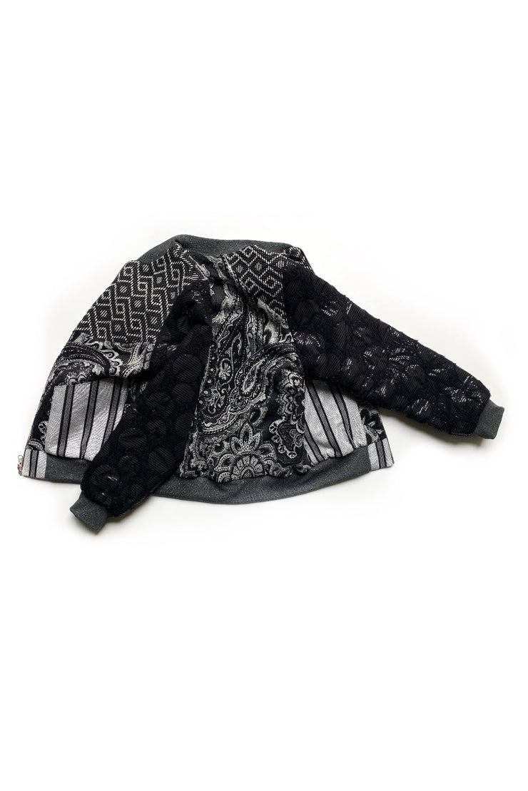 bomber réversible en patchwork de tissus noirs et gris à motifs graphiques